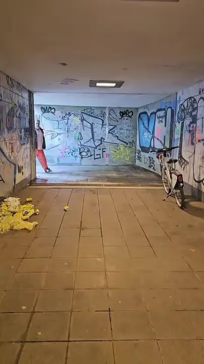 Still: an underpass covered in graffiti